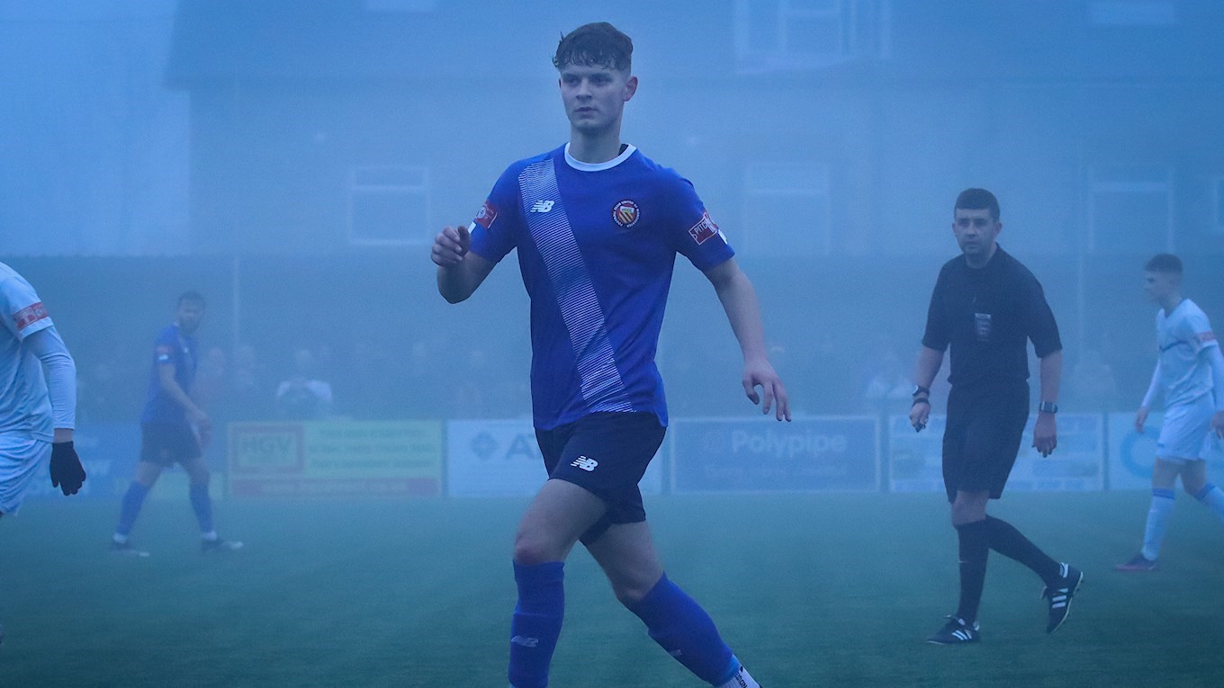 Harry Wilson (10) playing in thick fog as FC United of Manchester beat league leaders Buxton 2-1.