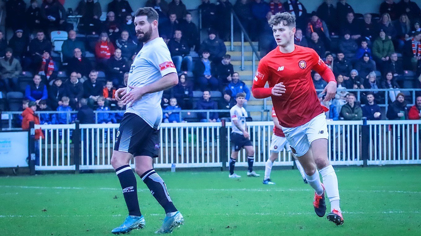 Harry Wilson (10) working hard against Academy coach Mark Yeates in FC United of Manchester